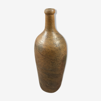 Old bottle in varnished sandstone glazed vintage