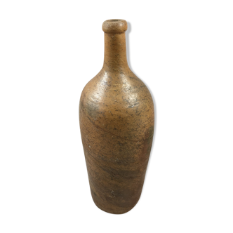 Old bottle in varnished sandstone glazed vintage