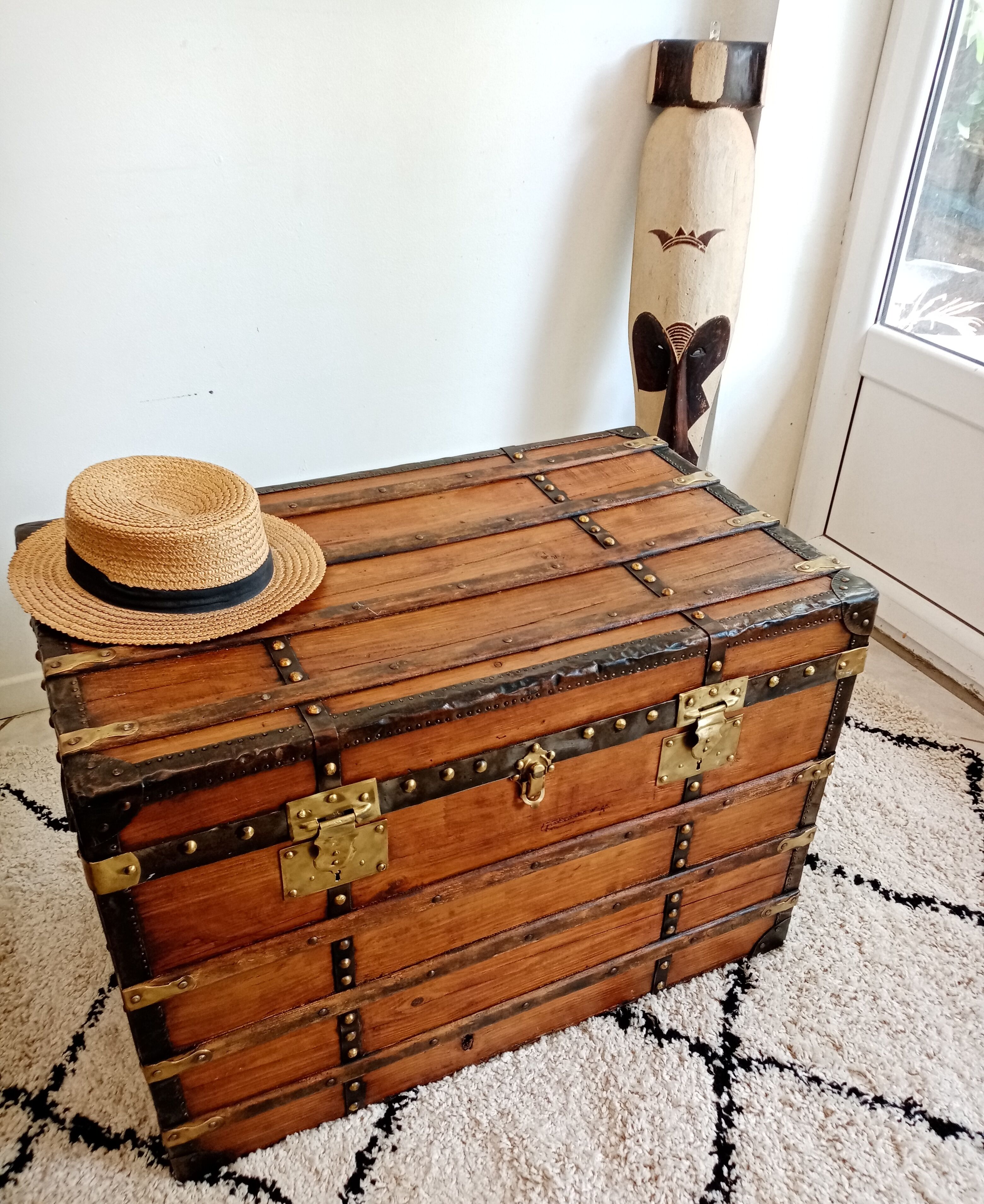Restored varnished wooden antique travel trunk