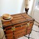 Restored varnished wooden antique travel trunk