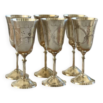 6 silver metal stemmed glasses.