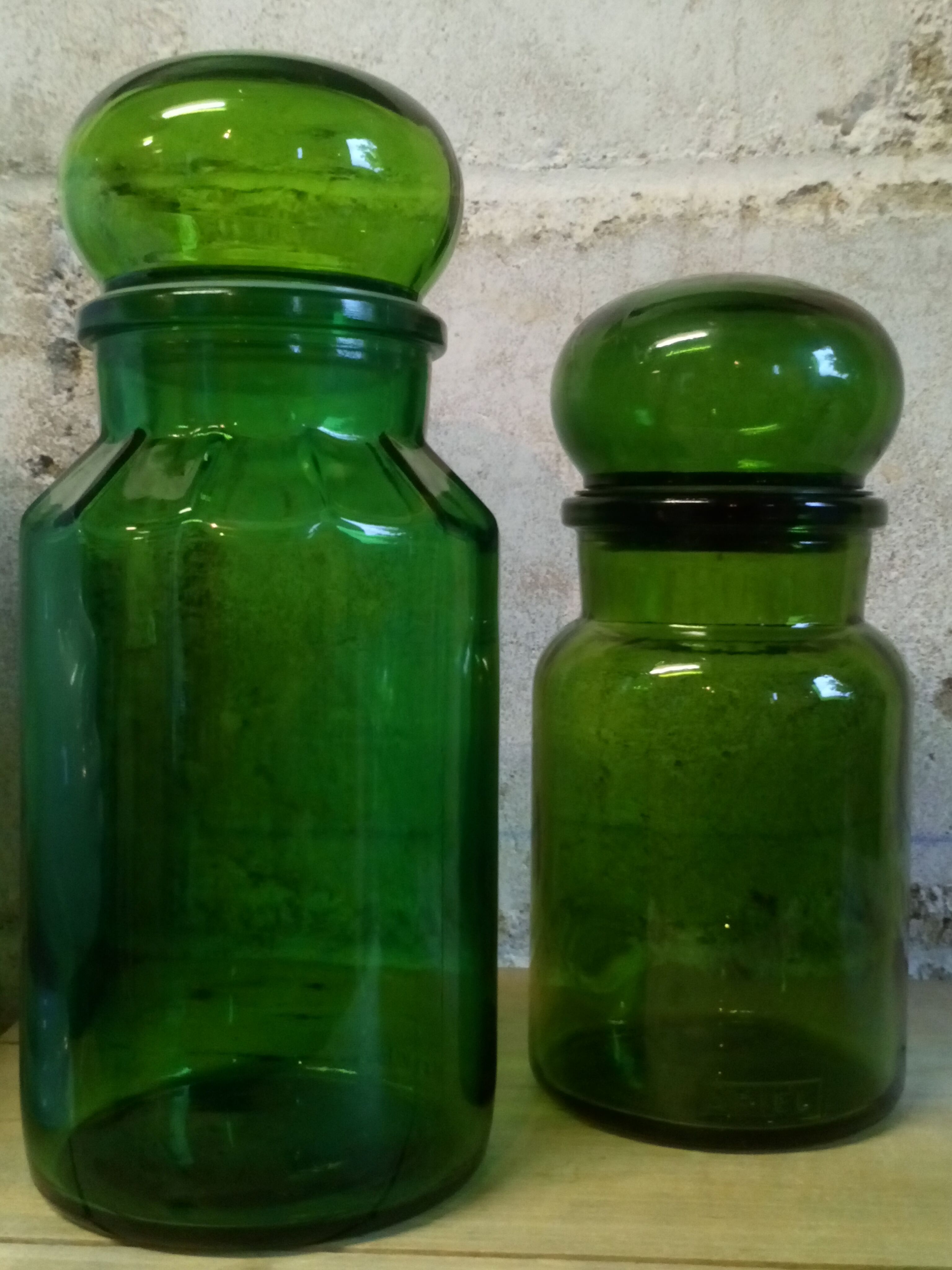 Trio of green glass apothecary bottles