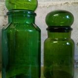 Trio of green glass apothecary bottles