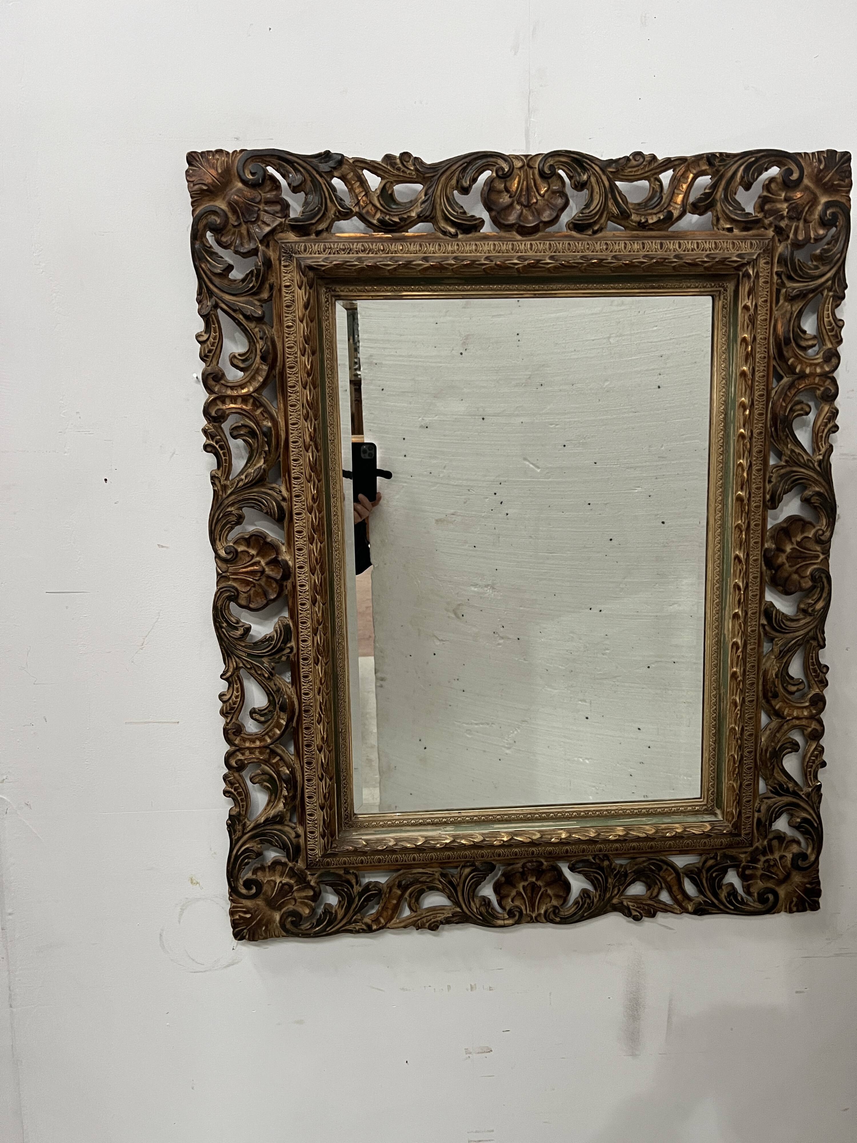 Napoleon III style mirror in carved wood, 20th century.