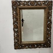 Napoleon III style mirror in carved wood, 20th century.