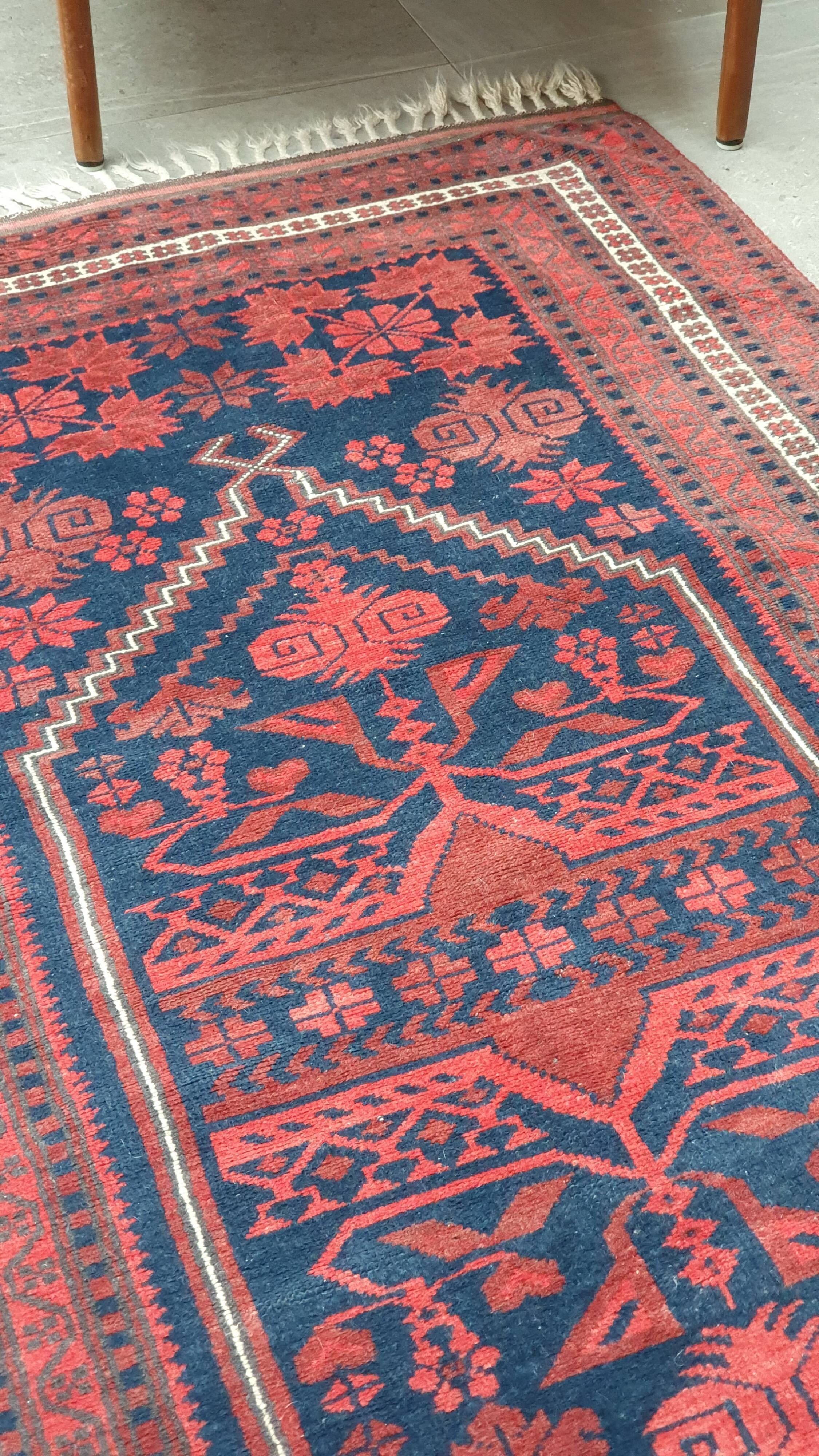 Old hand-knotted wool carpet