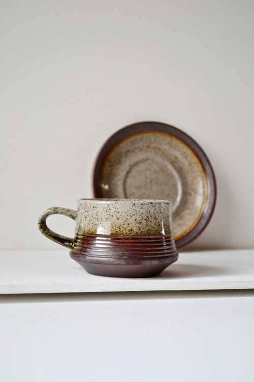 Cups and saucers in sandstone