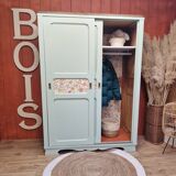 Wardrobe in old wood, renovated and restyled in celadon green