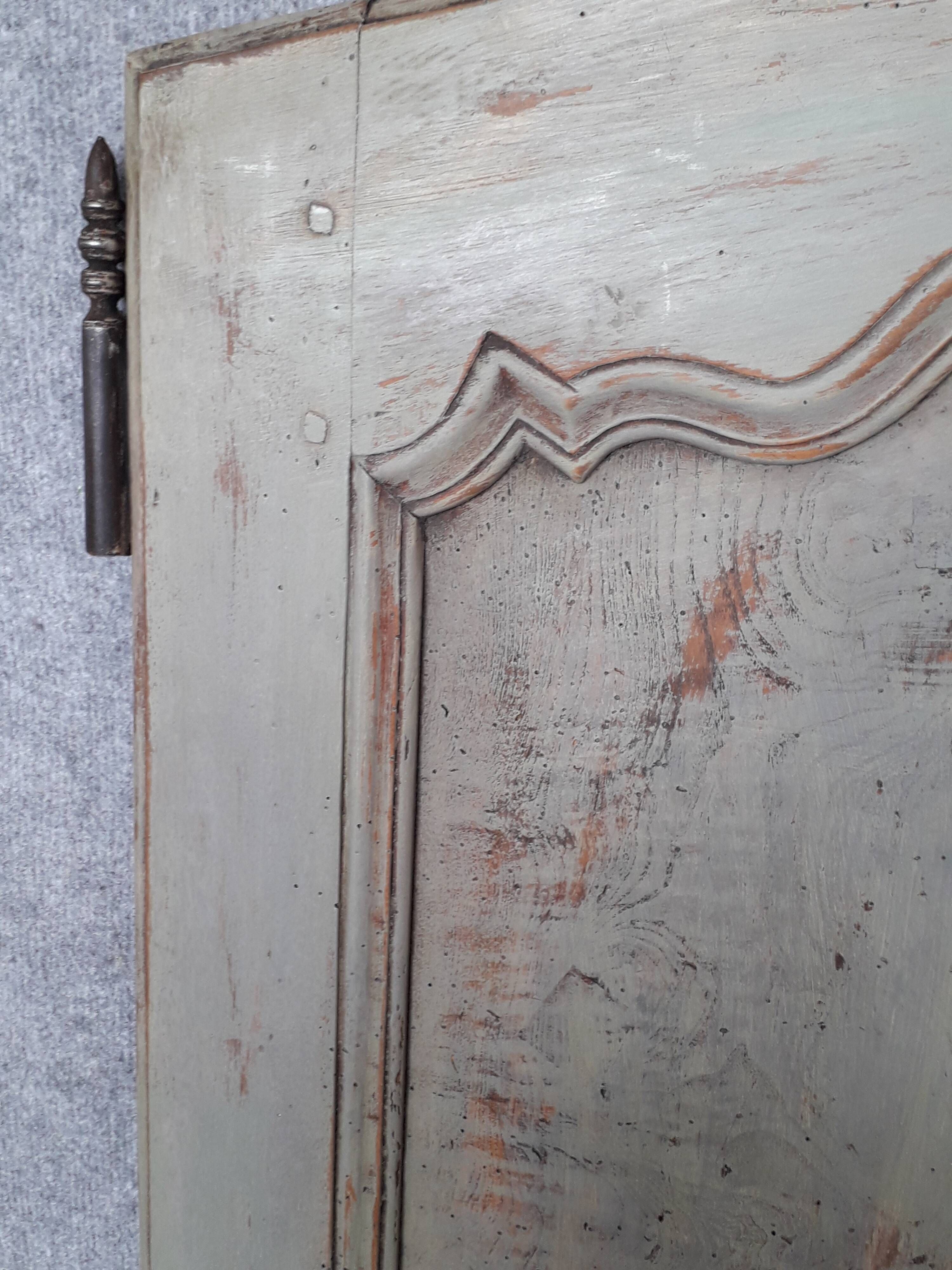 Pair of Louis XV period walnut and ash cabinet doors