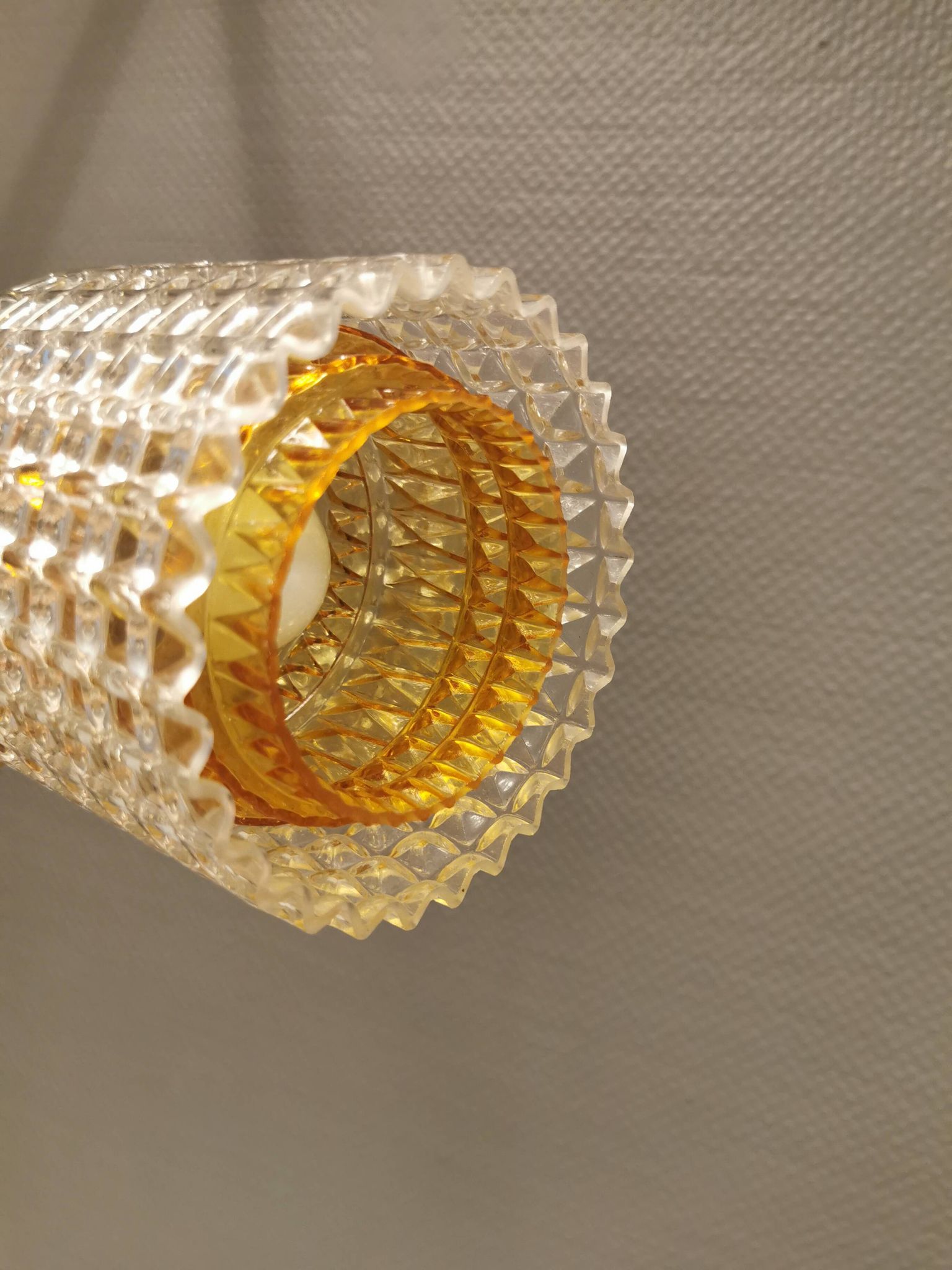 Older Swedish hanging lamp in multi-layered crystal glass with rosewood top and brass ring.