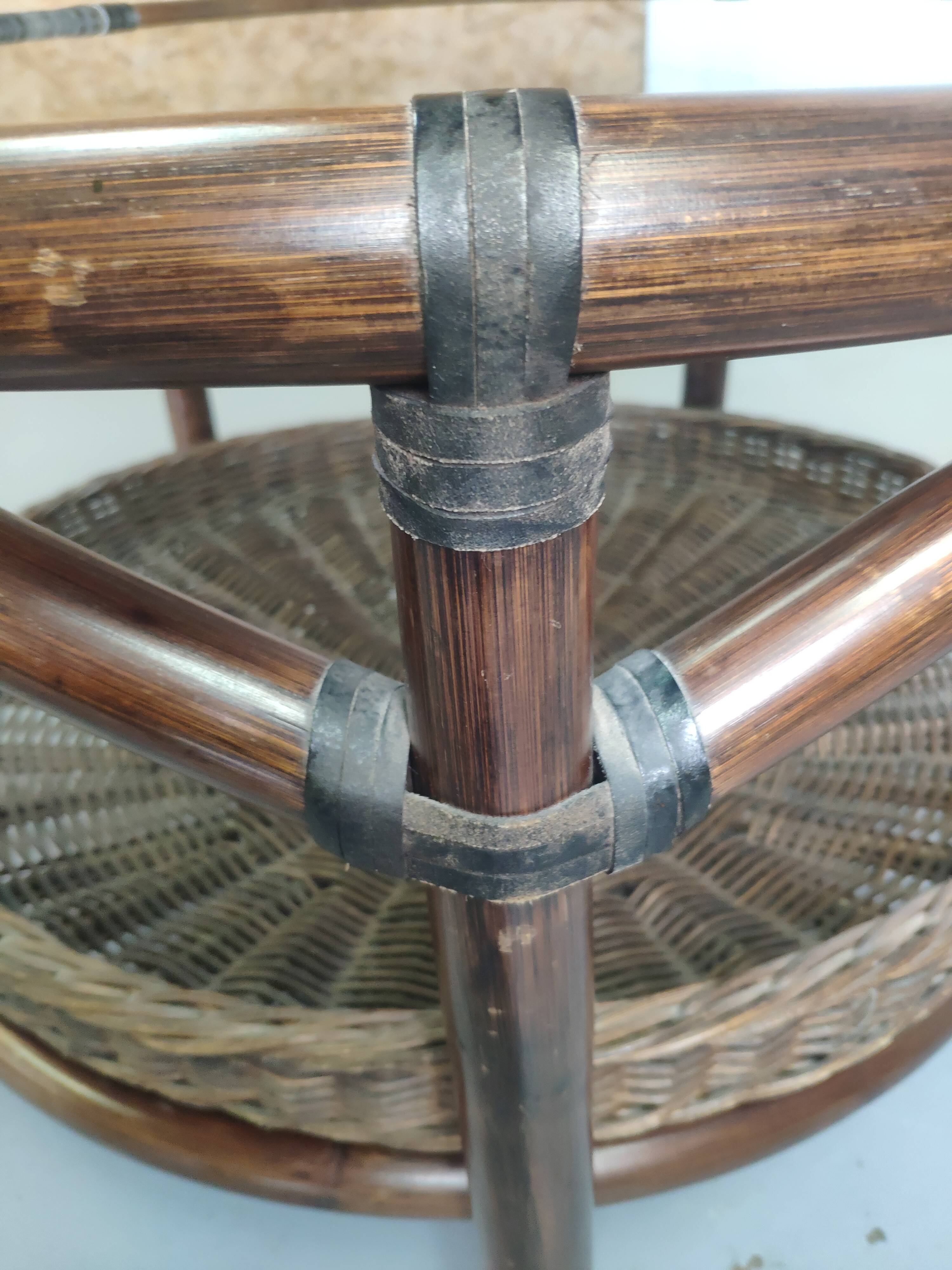 Vintage rattan coffee table with smoked glass top and rattan basket shelf