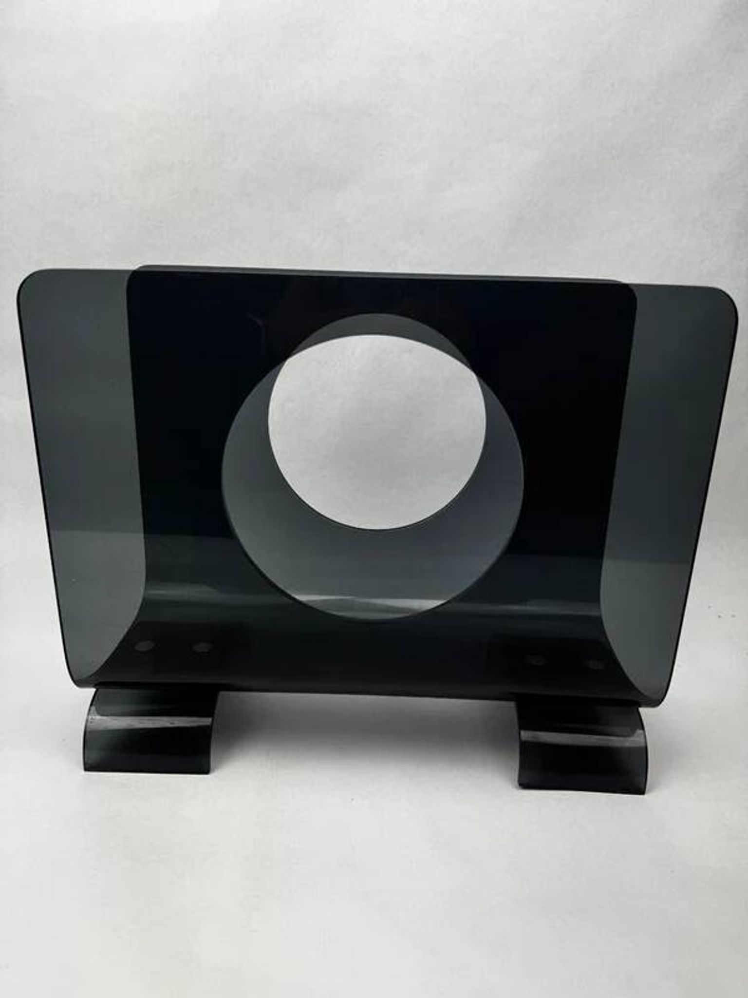 Vintage 1970s smoked plexiglass magazine rack, minimalist design.