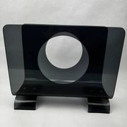 Vintage 1970s smoked plexiglass magazine rack, minimalist design.