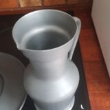 2 pitchers and 1 pewter pitcher