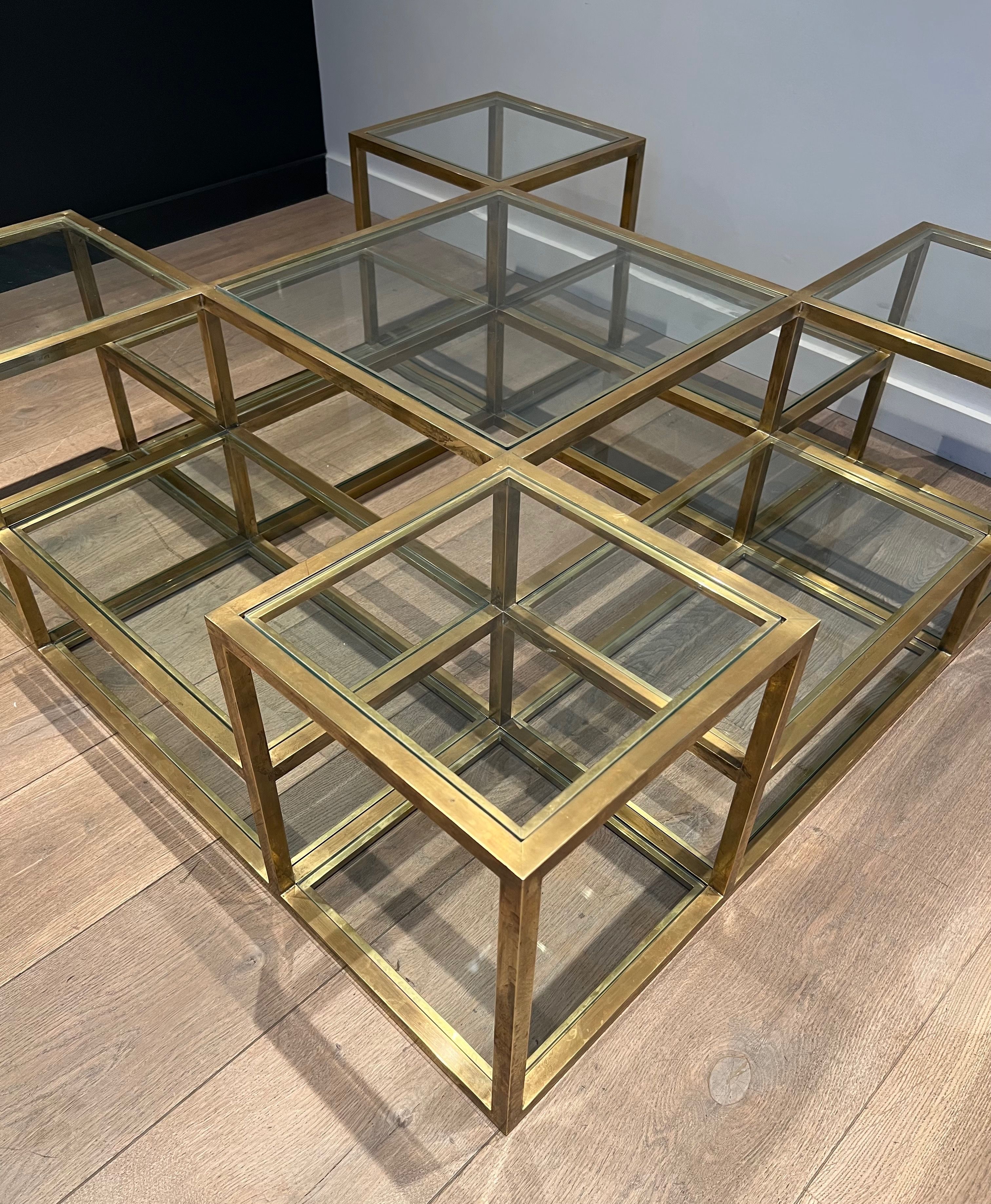 Important brass coffee table with multiple levels.