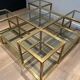 Important brass coffee table with multiple levels.