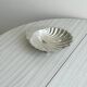 Metal shell plate