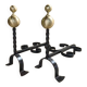Pair of wrought iron candlesticks with cast bronze ball, 1970s.