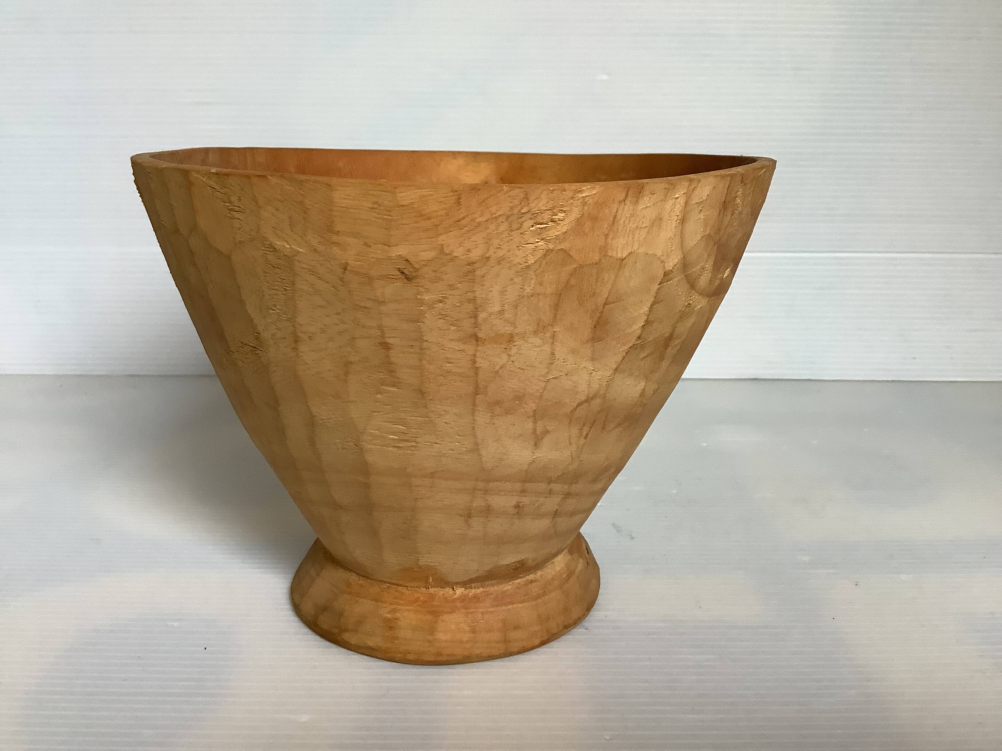 Asymmetrical wooden sculpted catchall.