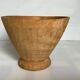 Asymmetrical wooden sculpted catchall.
