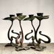 Ensemble de quatre bougeoirs en bronze de forme organique de style Art Nouveau
