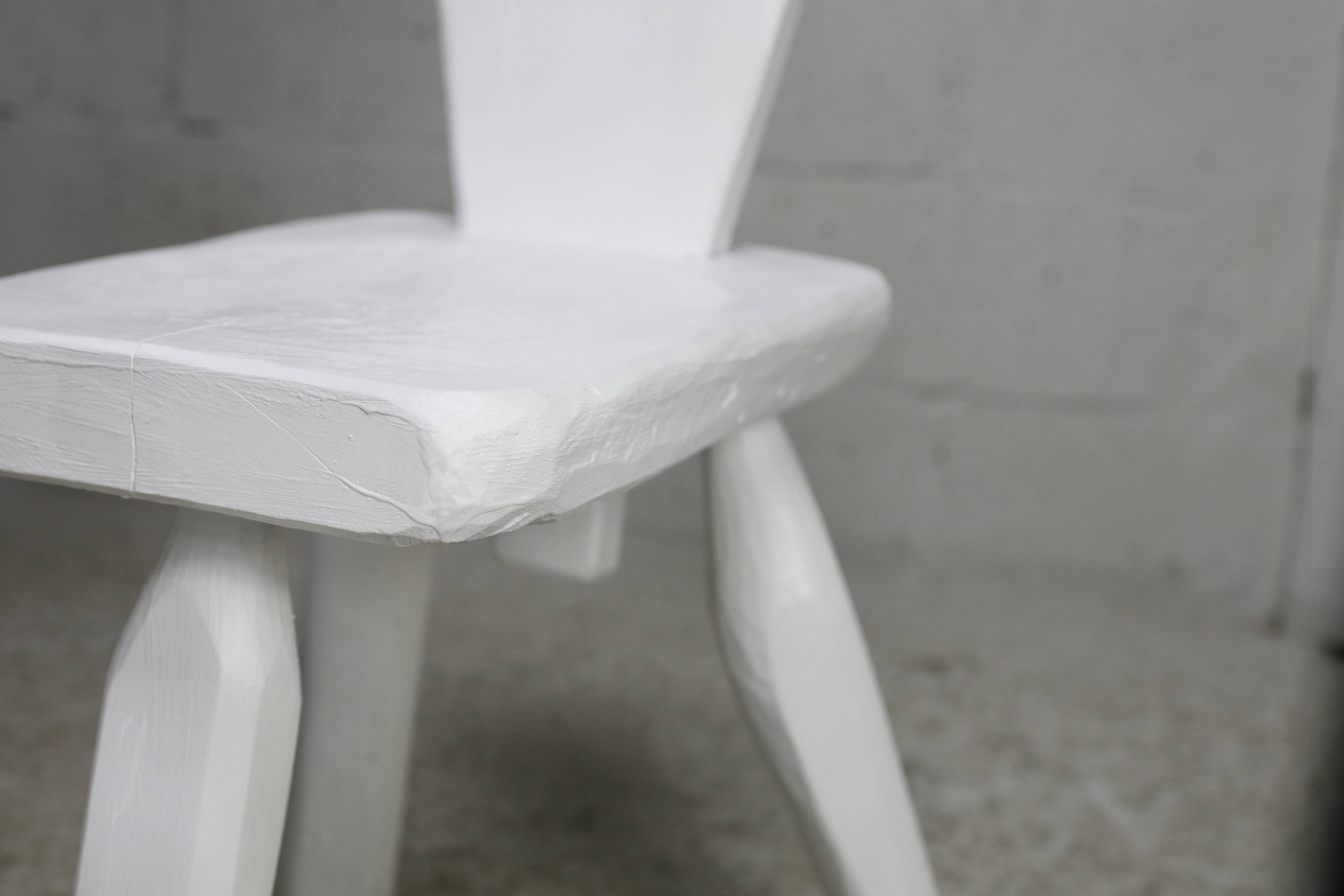 Pair of tripod chairs, gouged seats. Brutalist, circa 1960. Painted wood.