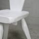 Pair of tripod chairs, gouged seats. Brutalist, circa 1960. Painted wood.