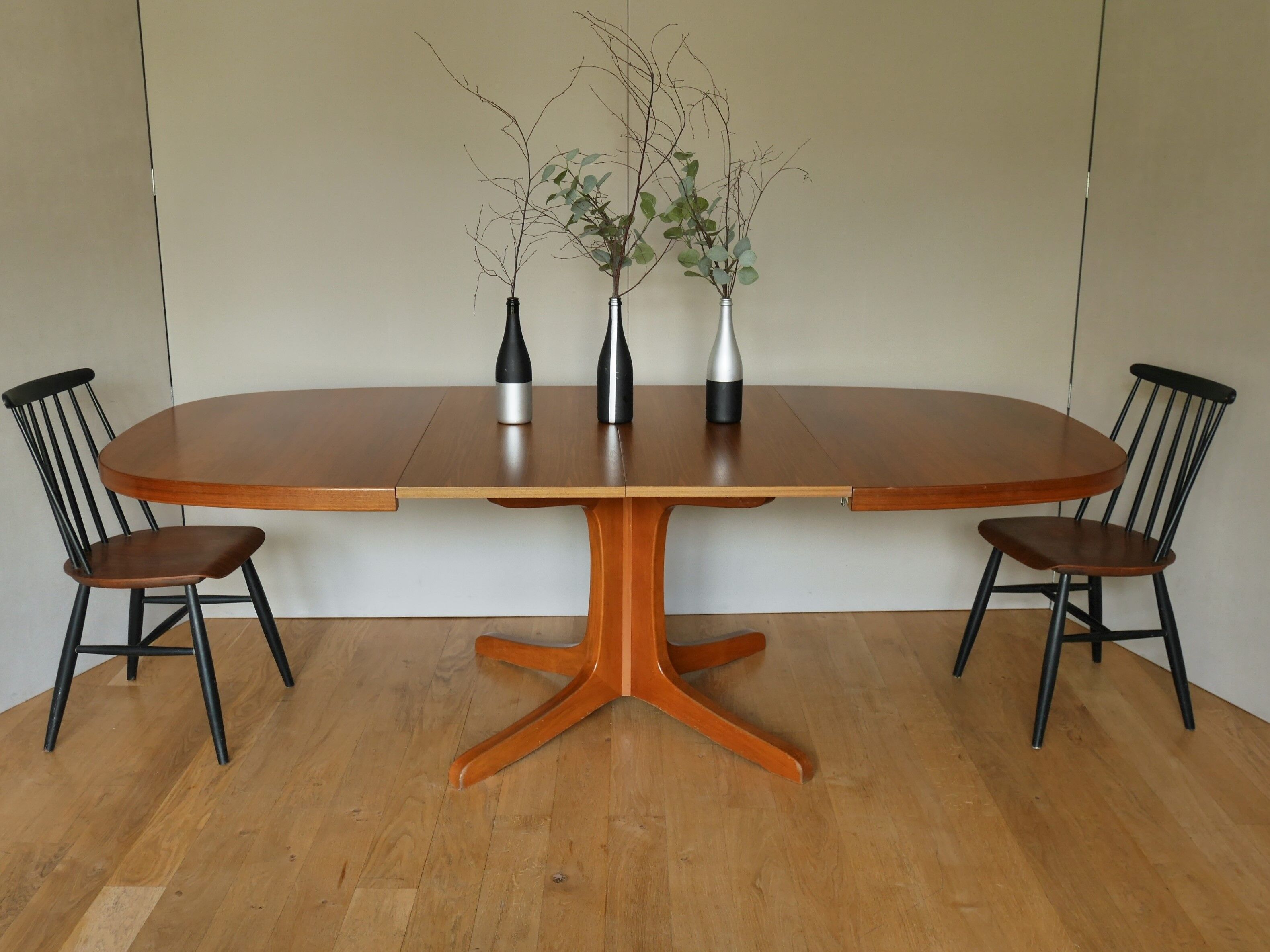 Baumann oval walnut table with extension cords