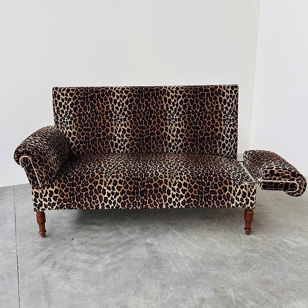 Vintage leopard velvet sofa / wall sofa with drop-down arms, France.