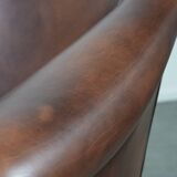 Great luxurious brown cowhide club armchair with matching piping