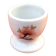 Ulysse Paris porcelain egg cup for Chanill with floral decoration.
