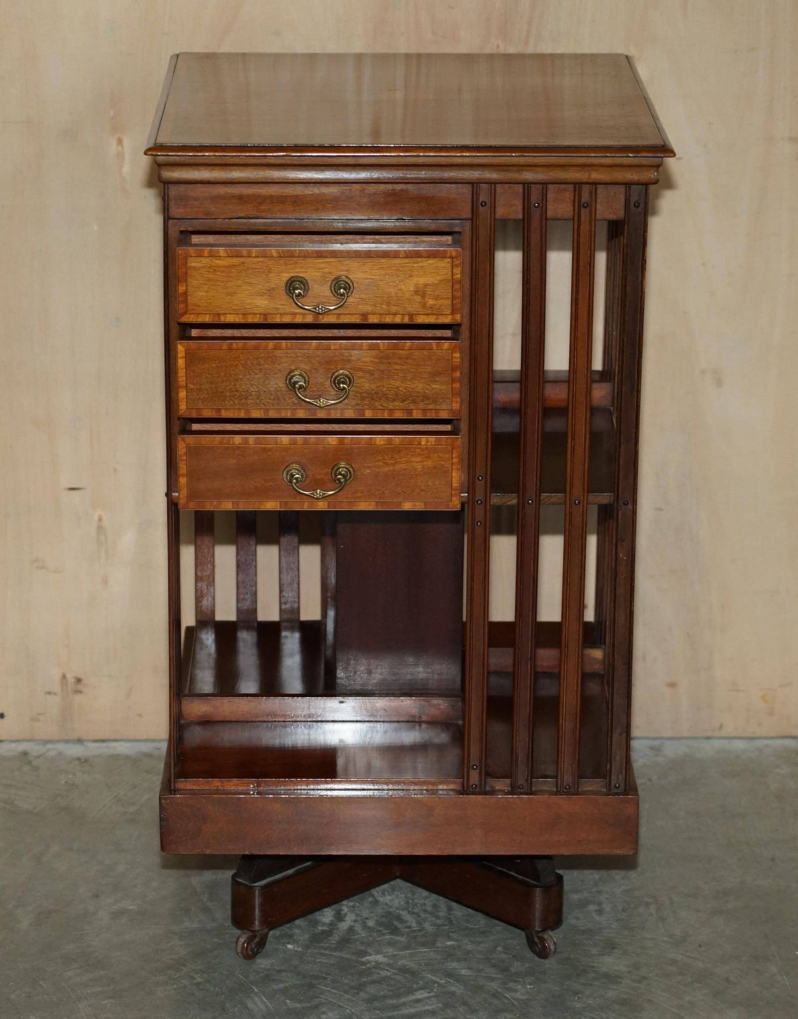 Restored Victorian walnut revolving library.