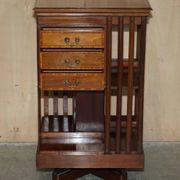 Restored Victorian walnut revolving library.