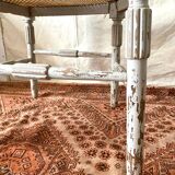 19th-century corner fireplace armchair, wood and cane.