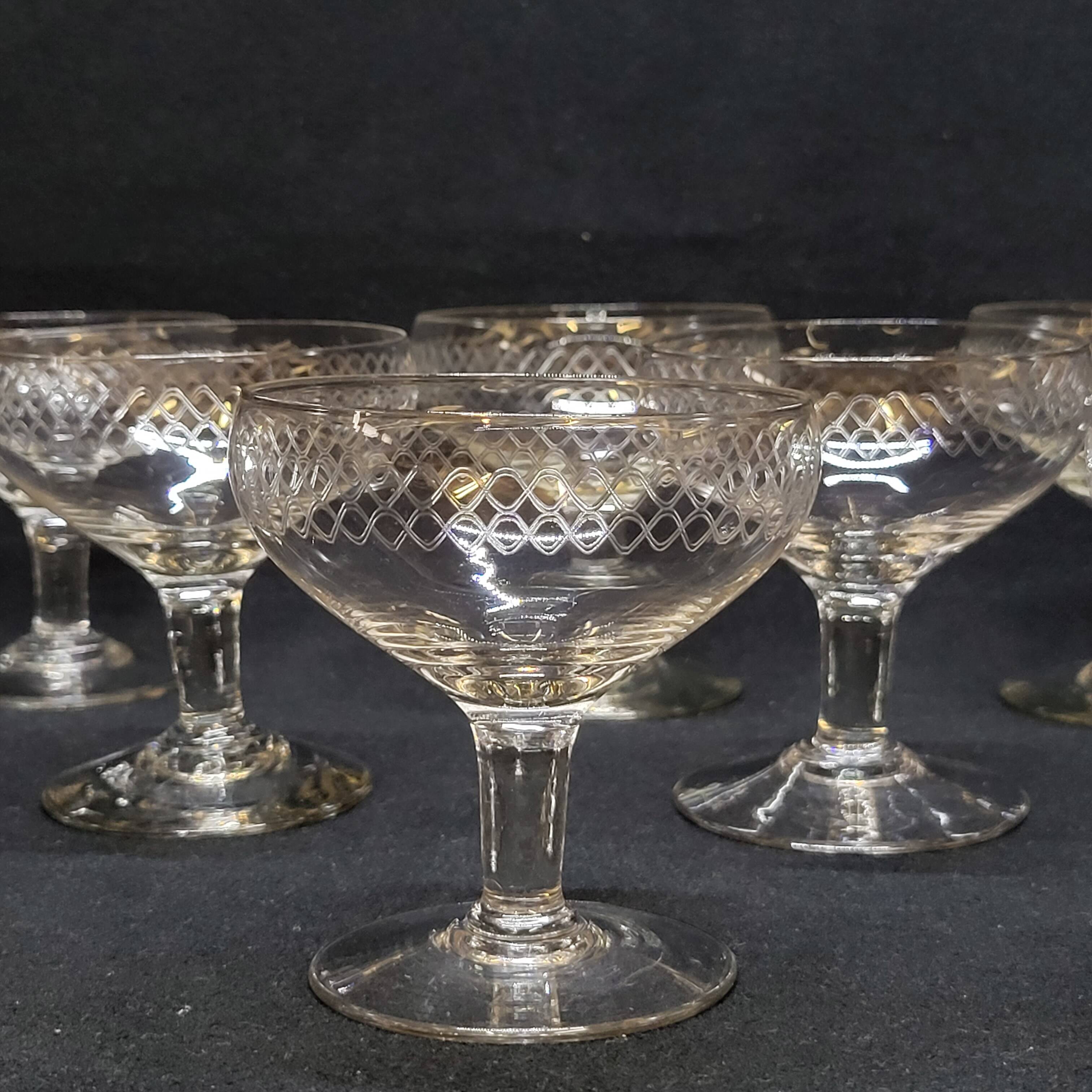 12 old champagne glasses in blown and engraved glass