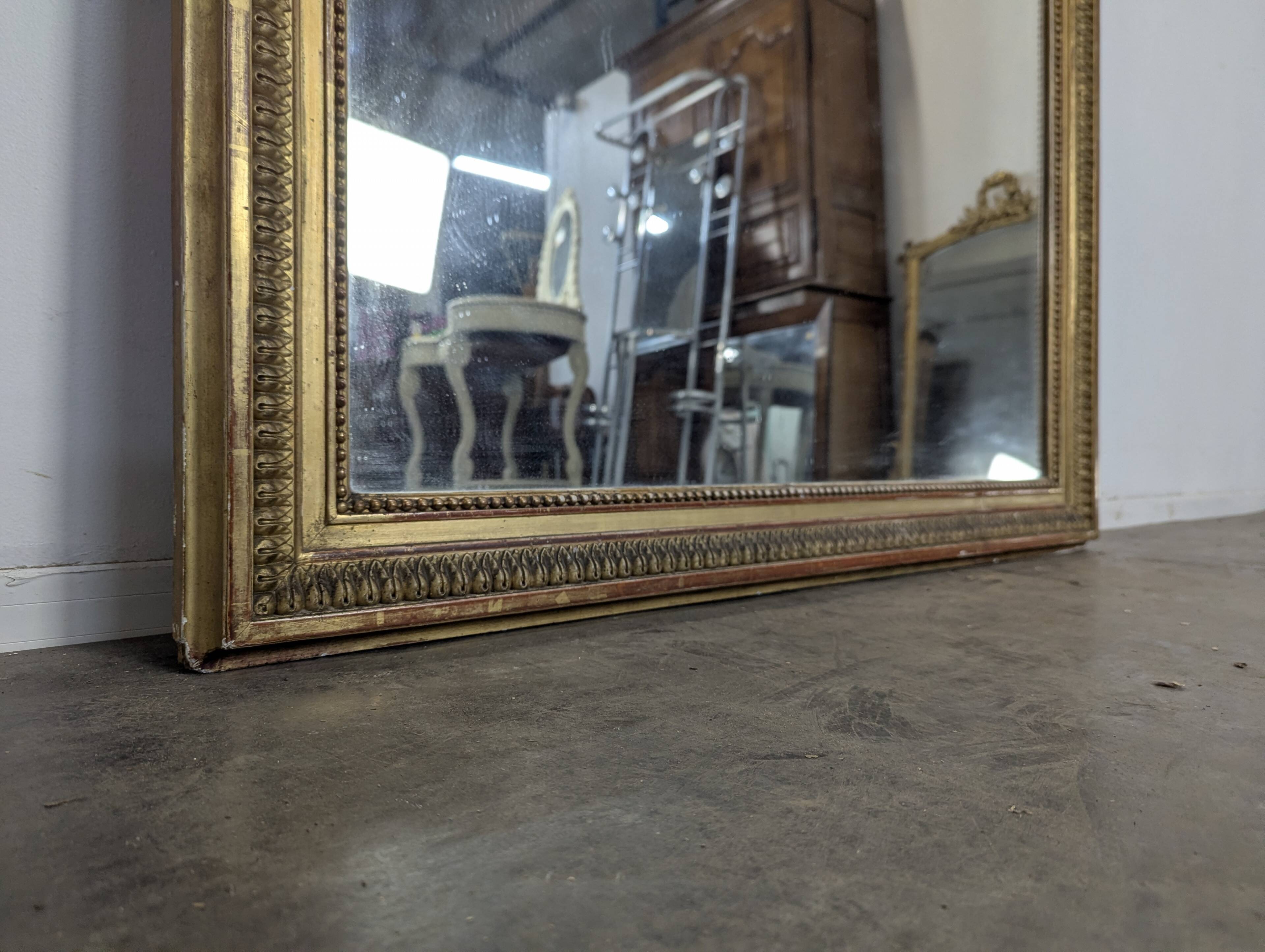 Large stucco and gilded wood mirror from the Napoléon III period.