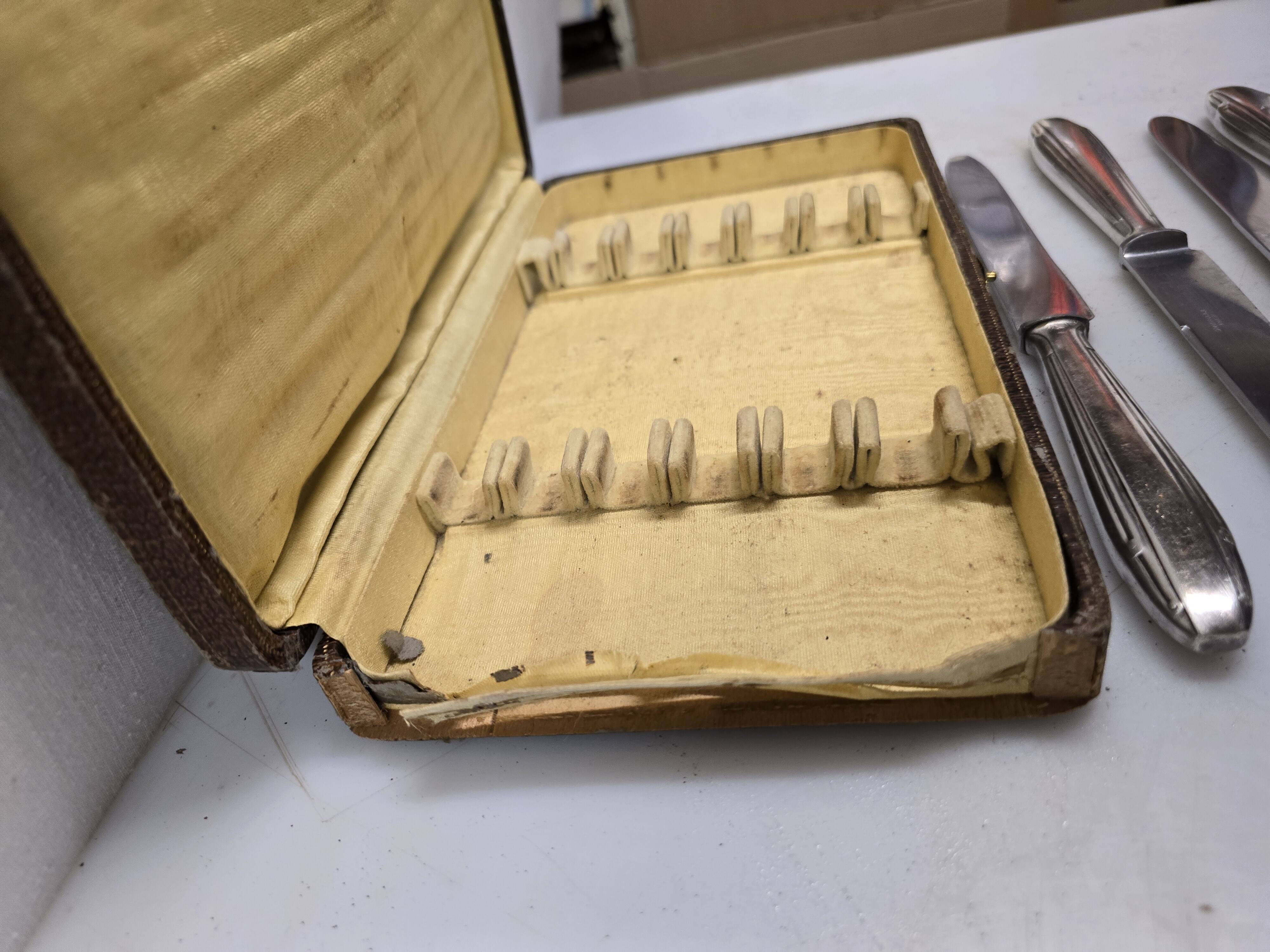 12 silver-plated knives from the mid-20th century