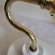 Brass flower and frosted glass sconce