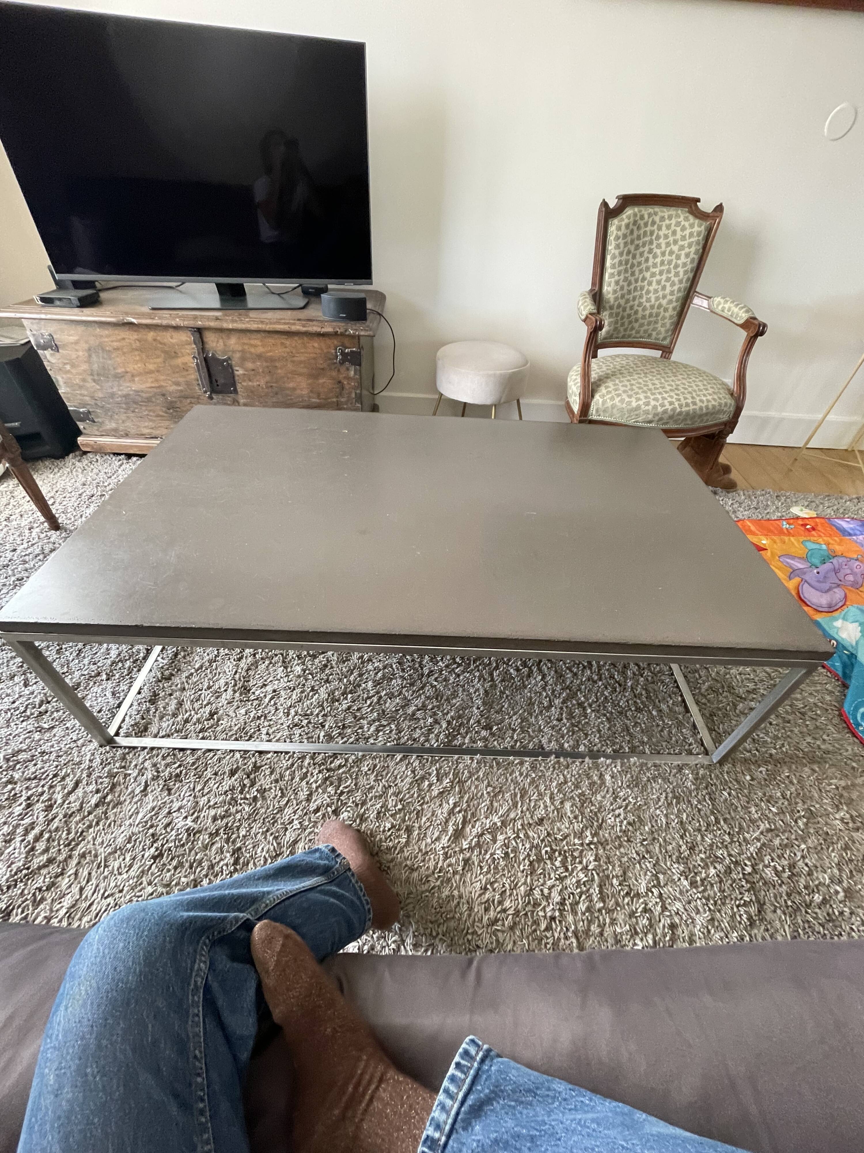 Coffee table in stone and brushed steel
