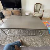 Coffee table in stone and brushed steel