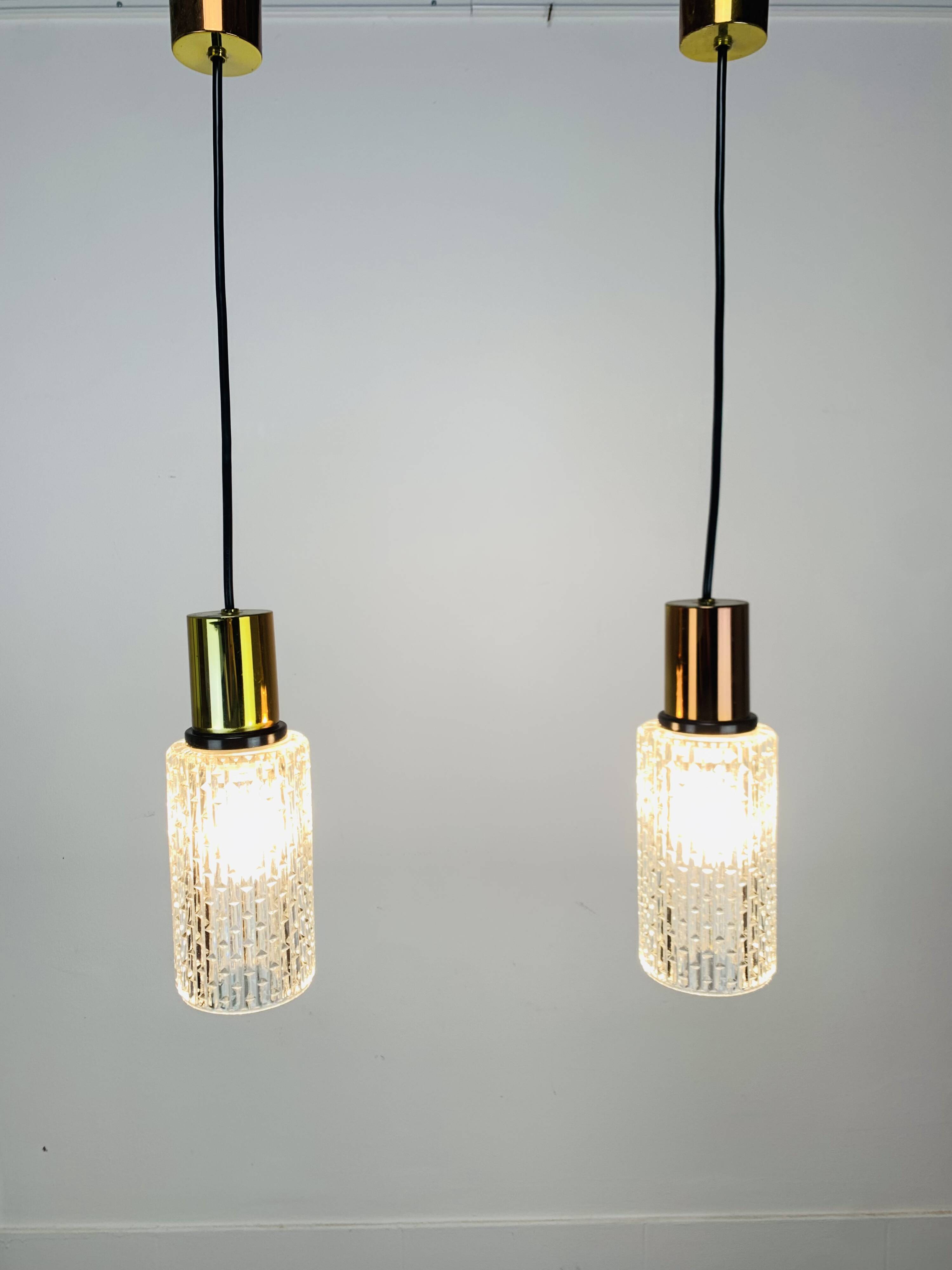 Pair of vintage cut glass pendant lights from the 1970s.