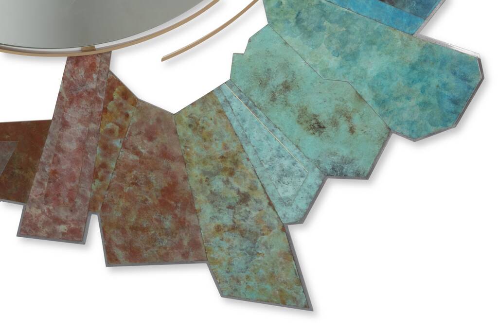 Contemporary mirror in oxidized bronze and brass with a deconstructed shape.