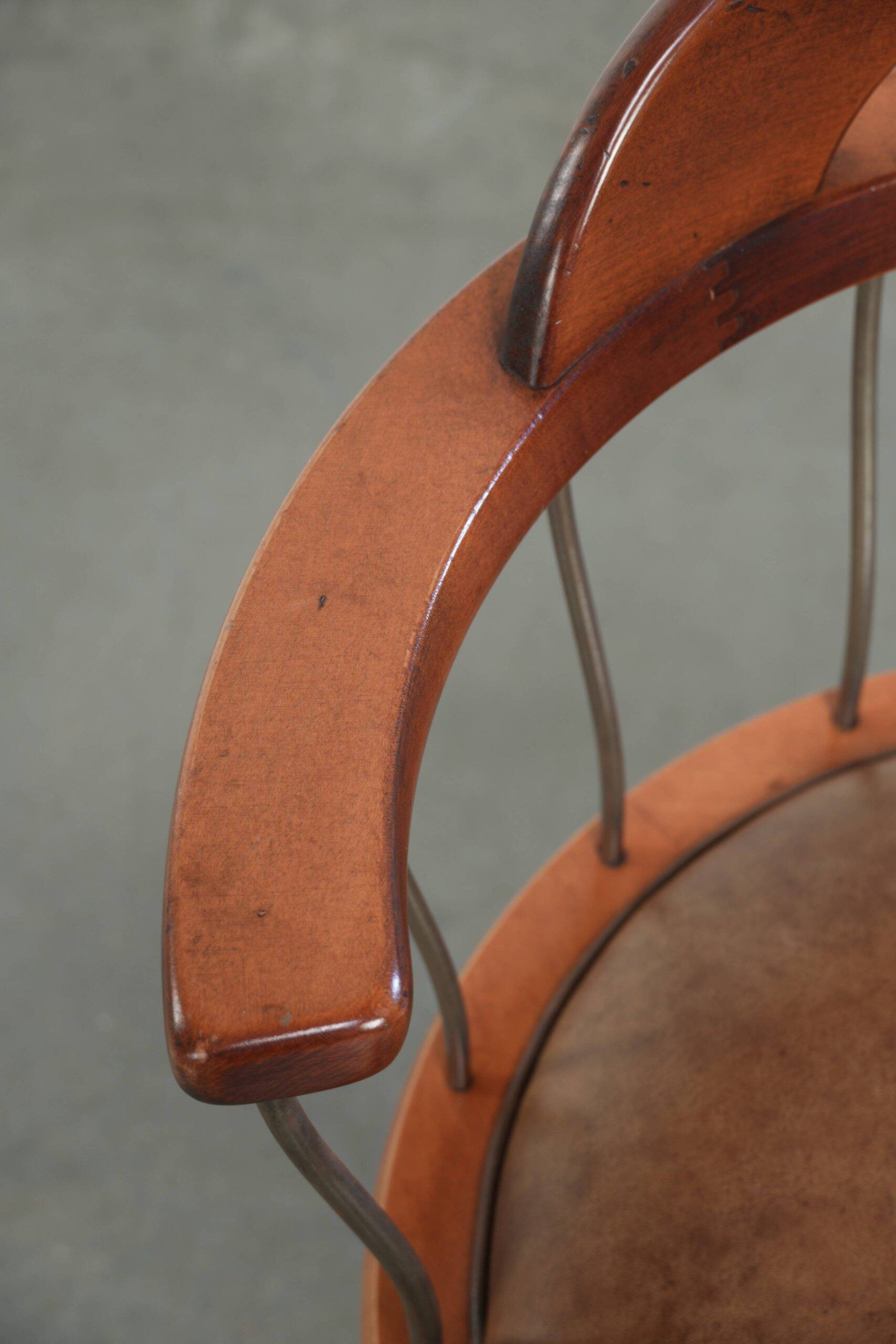 Swivel side chair / office chair with a cognac-coloured cow leather seat