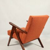 Vintage orange curly armchair Scandinavian design 1970