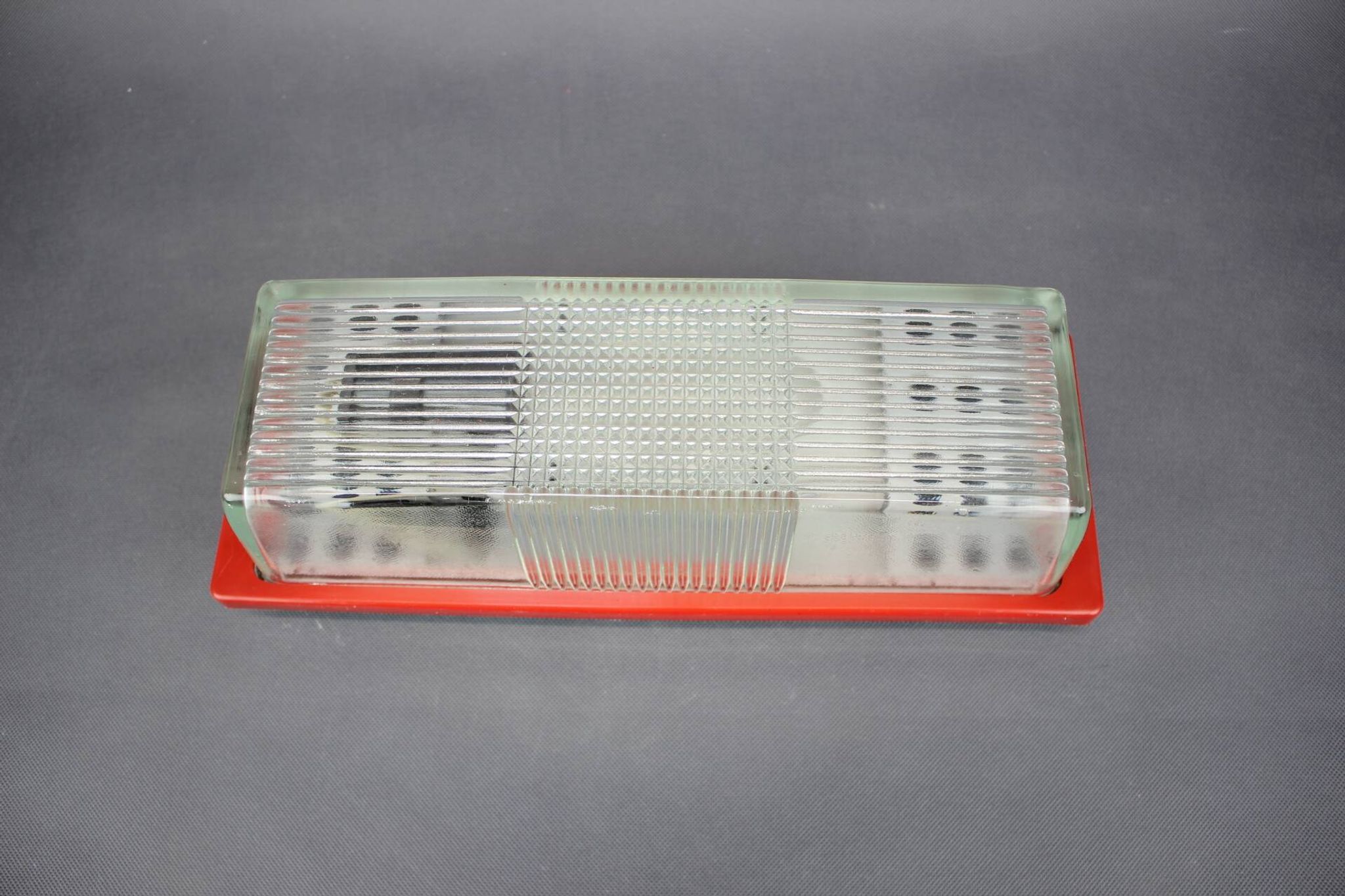 1970s Czech space age wall light with red plastic and glass.