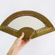 Old wall mirror in the shape of a copper fan pushed back, year 70