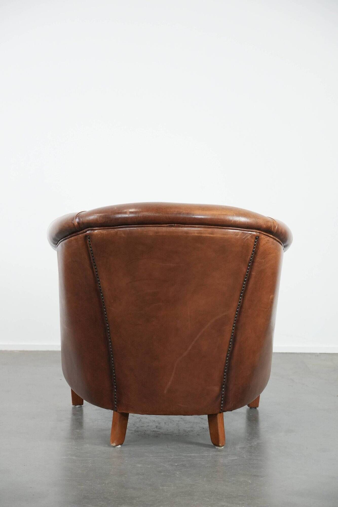 Comfortable club chair made of sheepskin leather