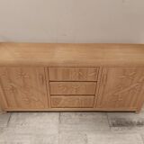 Vintage wicker sideboard with flowers