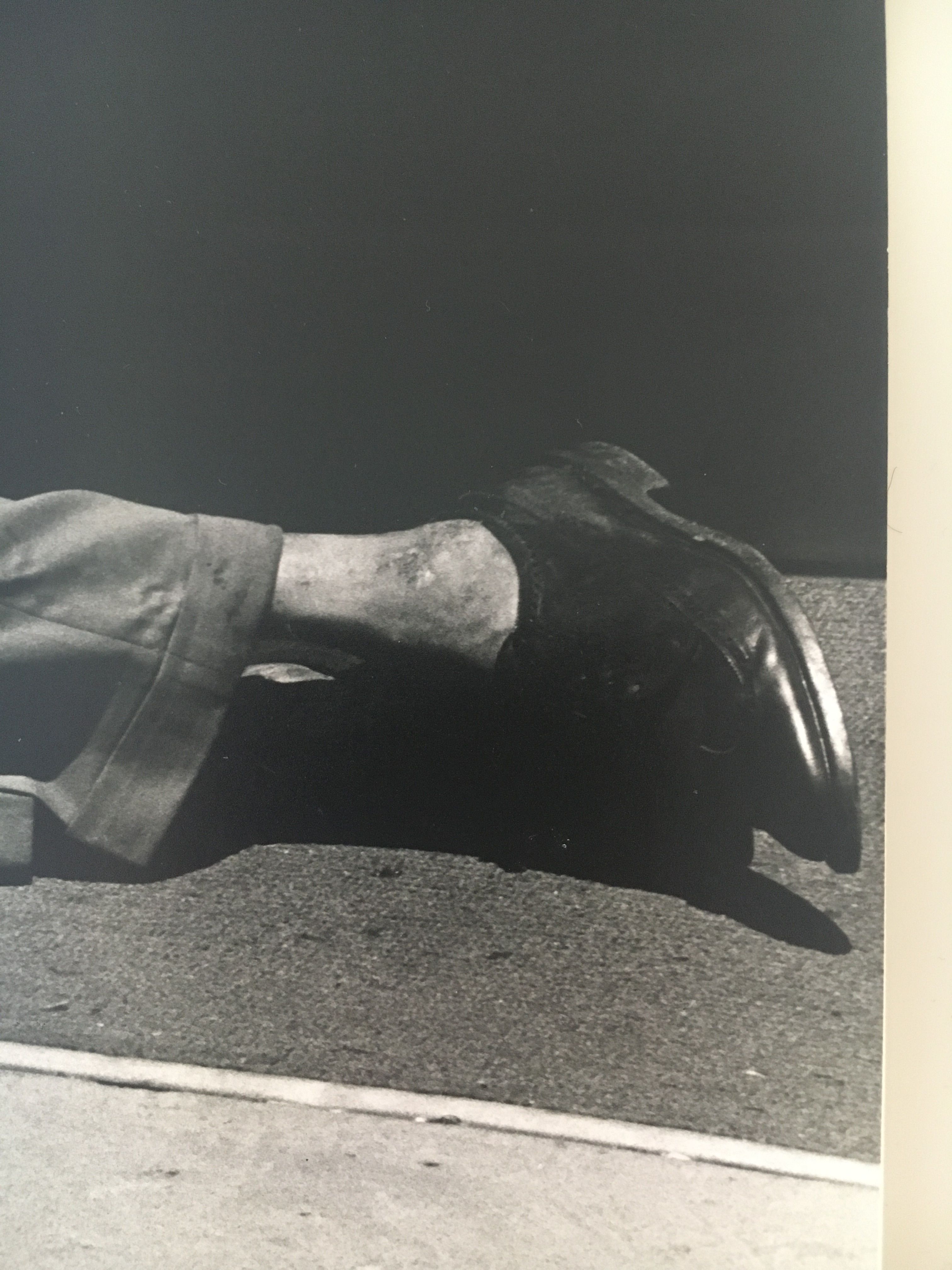 Shooting a man in the street. American poverty, 1980s