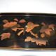 Set of two brown and black Chinese lacquer trays with bird decor